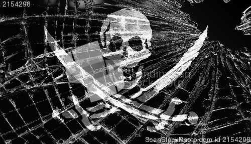 Image of Pirate flag under broken ice or glass