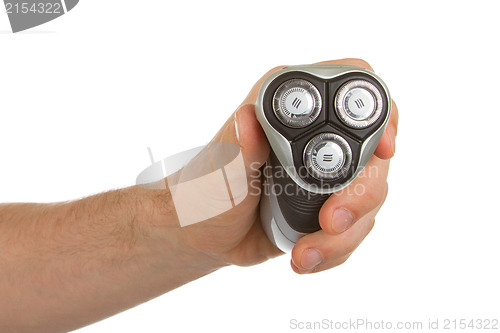 Image of Hand holding an electric shaver 