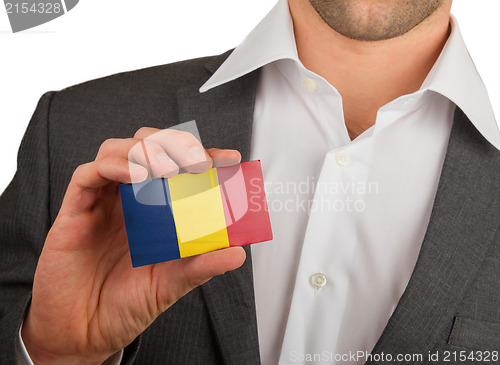 Image of Businessman is holding a business card, Romania