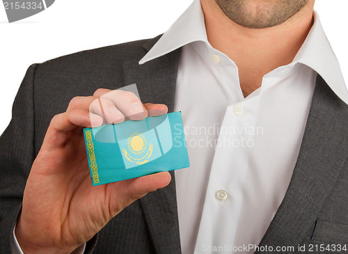 Image of Businessman is holding a business card, Kazakhstan