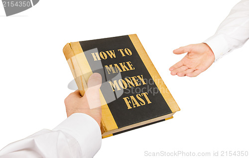 Image of Businessman giving an used book to another businessman