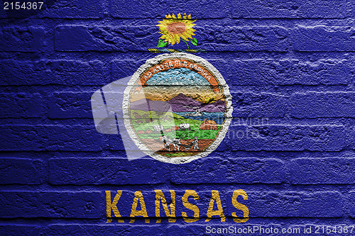 Image of Brick wall with a painting of a flag, Kansas