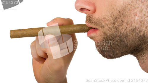 Image of Man with beard is holding an unused cigar