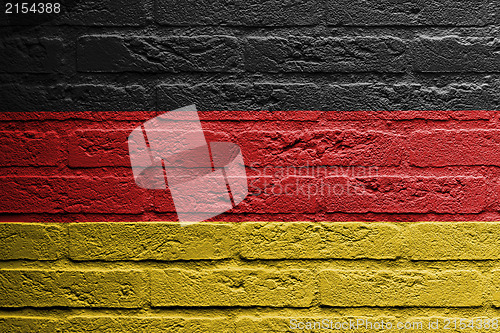 Image of Brick wall with a painting of a flag