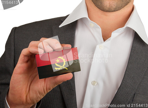 Image of Businessman is holding a business card, Angola