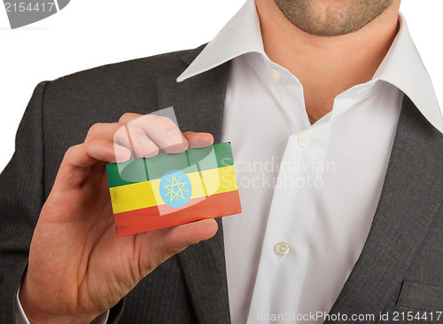 Image of Businessman is holding a business card, Ethiopia
