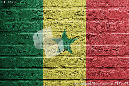 Image of Brick wall with a painting of a flag, Senegal