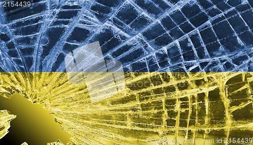 Image of Broken glass or ice with a flag, Ukraine