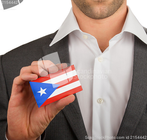 Image of Businessman is holding a business card, Puerto RIco