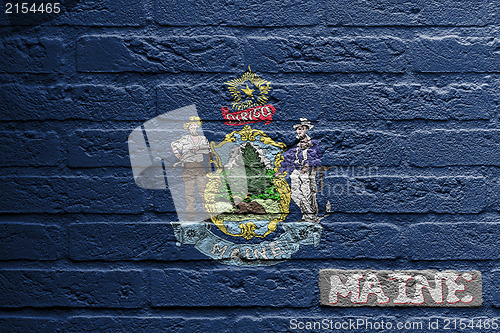 Image of Brick wall with a painting of a flag, Maine