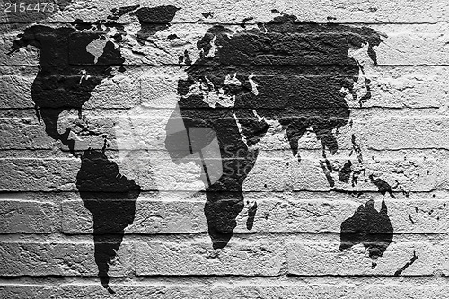 Image of Brick wall with a painting of a flag, World Map