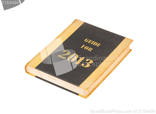 Image of Old book with a guide for 2013 concept title