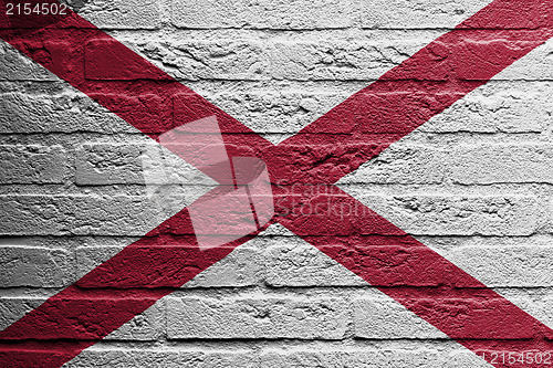 Image of Brick wall with a painting of a flag, Alabama