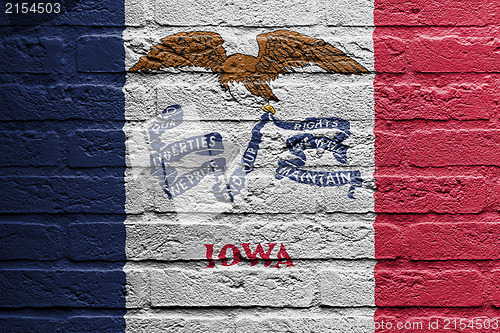 Image of Brick wall with a painting of a flag, Iowa