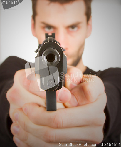 Image of Man with a gun ready to shoot