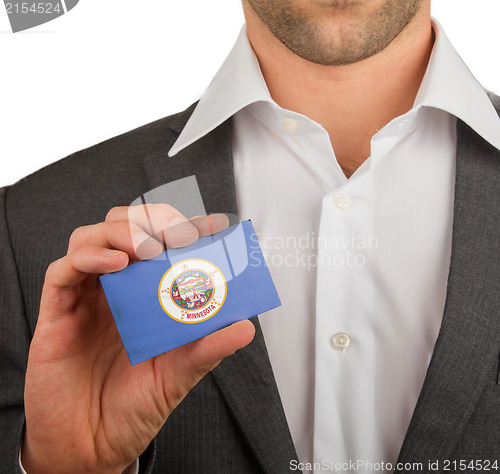 Image of Businessman is holding a business card, Minnesota
