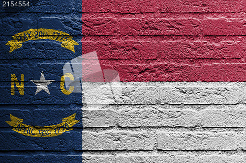 Image of Brick wall with a painting of a flag, North Carolina