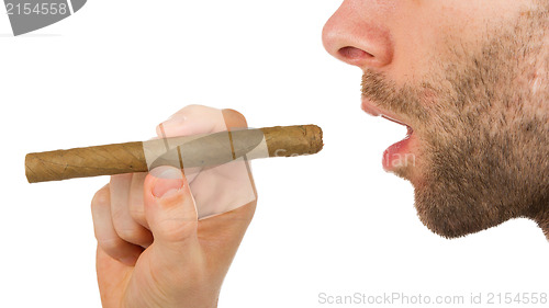 Image of Man with beard is holding an unused cigar