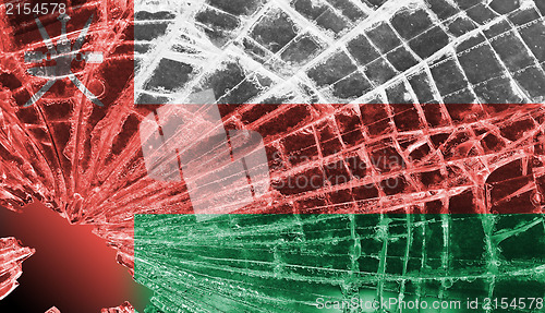 Image of Broken glass or ice with a flag, Oman