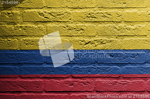 Image of Brick wall with a painting of a flag, Colombia