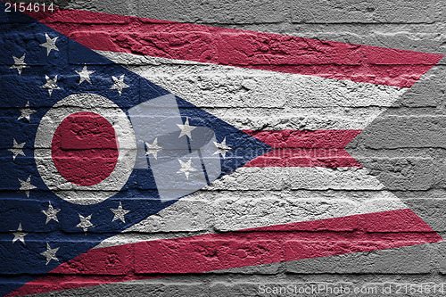 Image of Brick wall with a painting of a flag, Ohio