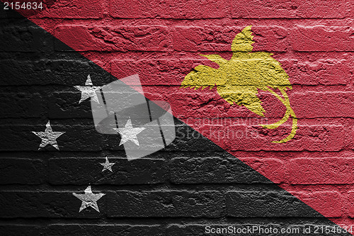 Image of Brick wall with a painting of a flag, Papua New Guinea