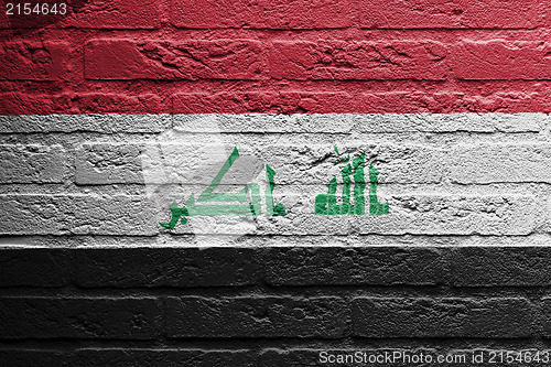 Image of Brick wall with a painting of a flag, Iraq