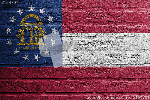 Image of Brick wall with a painting of a flag, Georgia