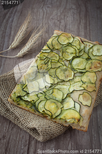 Image of Sliced pizza with zucchini