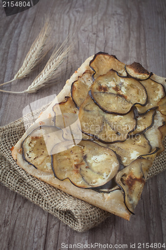 Image of Sliced pizza with eggplants