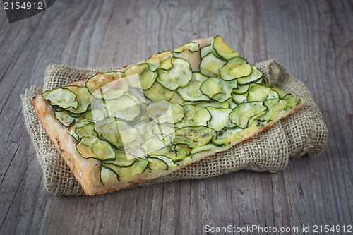 Image of Sliced pizza with zucchini