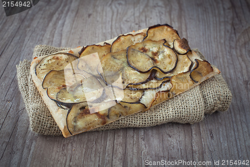 Image of Sliced pizza with eggplants