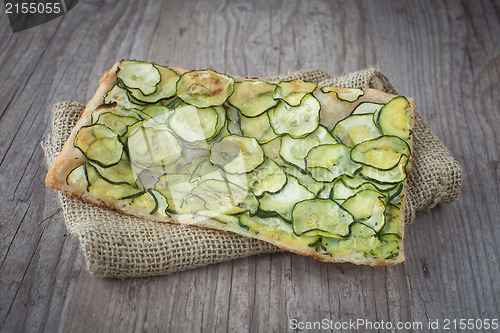 Image of Sliced pizza with zucchini