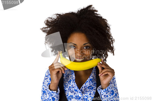 Image of Young afro american with banana