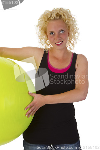 Image of Beautiful young woman with gym ball