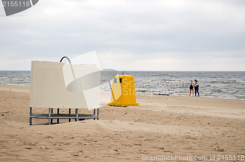 Image of wear change cabin waste bin sea beach people 