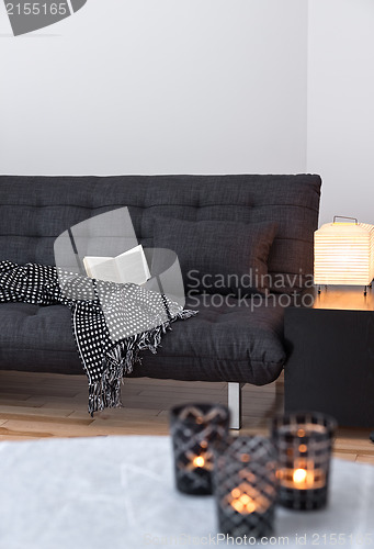 Image of Gray sofa and cozy lights in the living room
