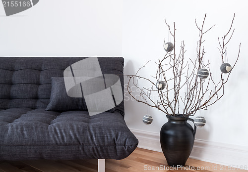 Image of Gray sofa and simple winter decorations