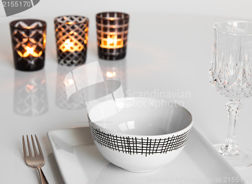 Image of Table setting with three candles
