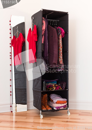 Image of Clothes organizer with clothing and accessories