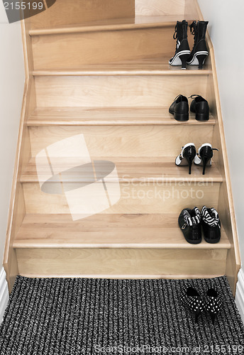 Image of Shoes on a wooden staircase