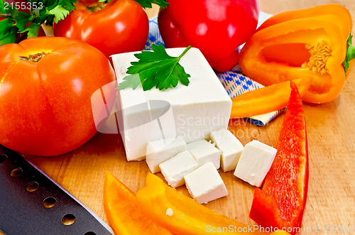 Image of Feta cheese with vegetables on the board