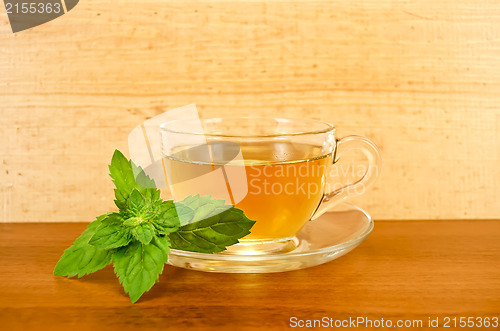 Image of Herbal tea with mint on a wooden board