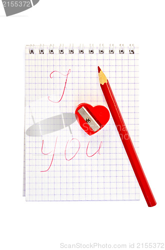 Image of Sharpener in the shape of heart with an inscription in notepad