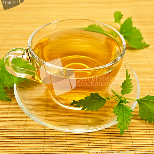 Image of Herbal tea with nettles on a bamboo mat