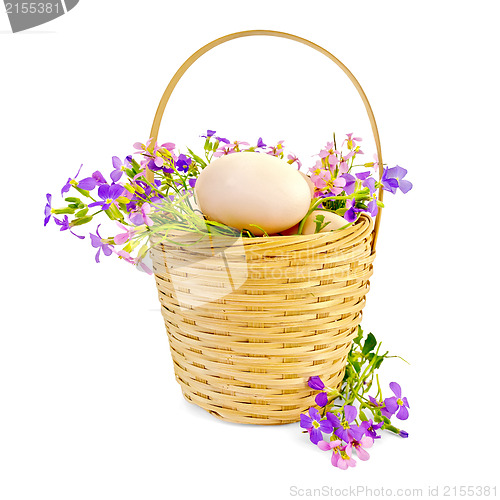 Image of Eggs with flowers in a wicker basket