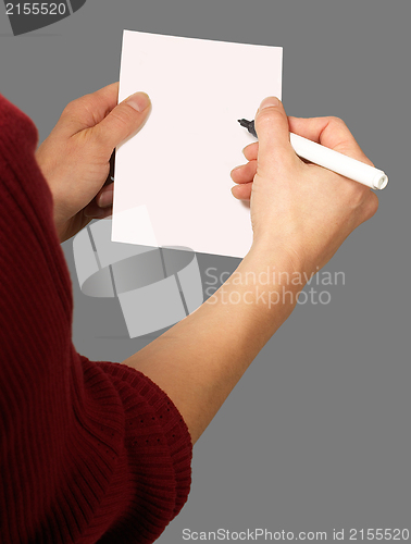 Image of woman with chit and pen