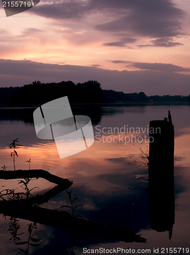Image of Romantic sunset on the lake with fog