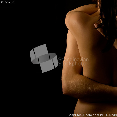 Image of Hands hugging a girl in passion