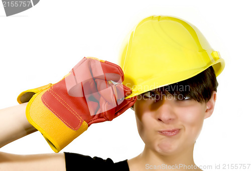Image of Girl in yellow hard hat and red gloves with funny face